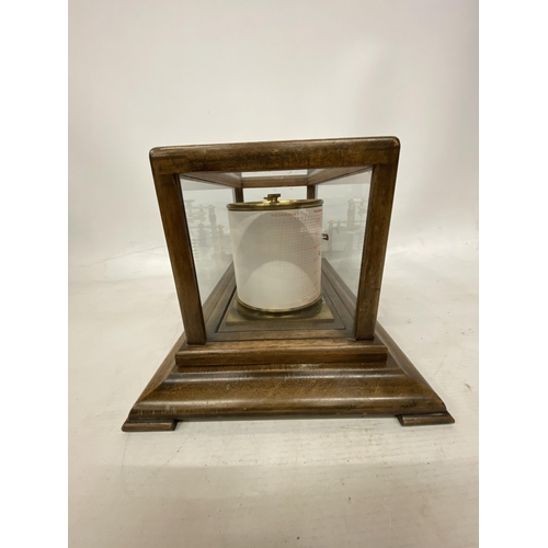 35 - A VINTAGE OAK CASED BAROGRAPH WITH SPARE CHARTS