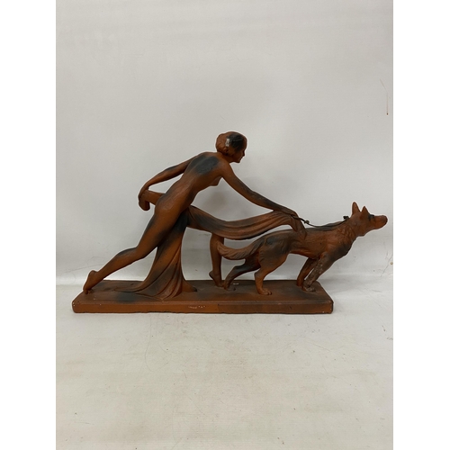 38 - AN ART DECO TERRACOTTA FIGURE OF A LADY AND HOUND 29