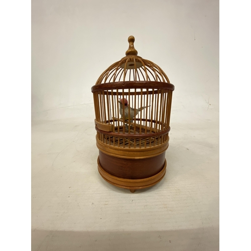 4 - A VINTAGE BAMBOO BIRD CAGE WITH SINGING GOLDFINCH IN WORKING ORDER BUT NO WARRANTY GIVEN