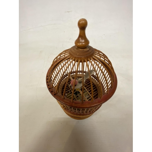 4 - A VINTAGE BAMBOO BIRD CAGE WITH SINGING GOLDFINCH IN WORKING ORDER BUT NO WARRANTY GIVEN