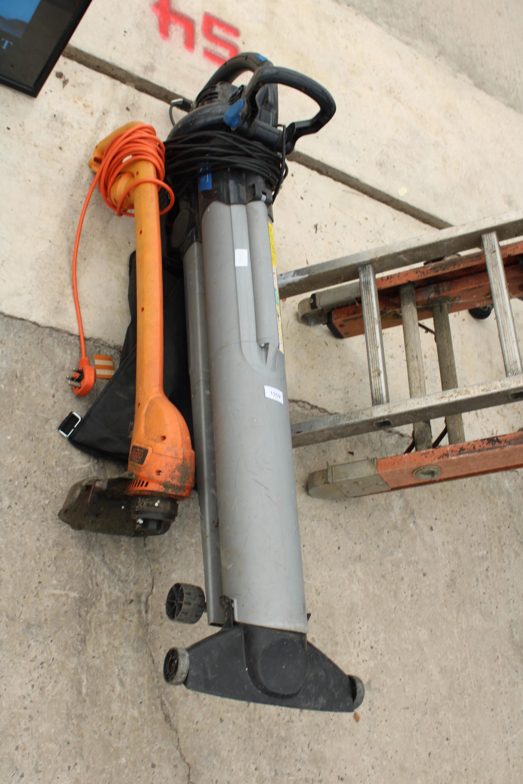 AN ELECTRIC MACALLISTER GARDEN VAC AND AN ELECTRIC STRIMMER