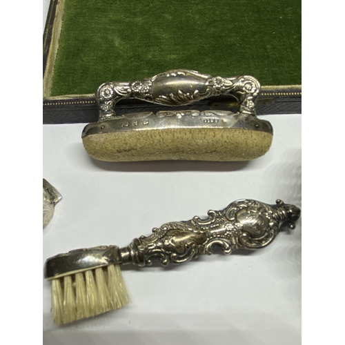 6A - THREE HALLMARKED BIRMINGHAM SILVER ITEMS TO INCLUDE A PIERCED DISH, TOOTHBRUSH AND NAIL BUFFER AND A... 