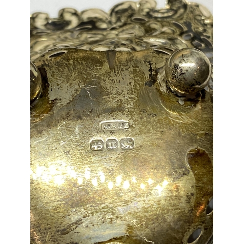 6A - THREE HALLMARKED BIRMINGHAM SILVER ITEMS TO INCLUDE A PIERCED DISH, TOOTHBRUSH AND NAIL BUFFER AND A... 