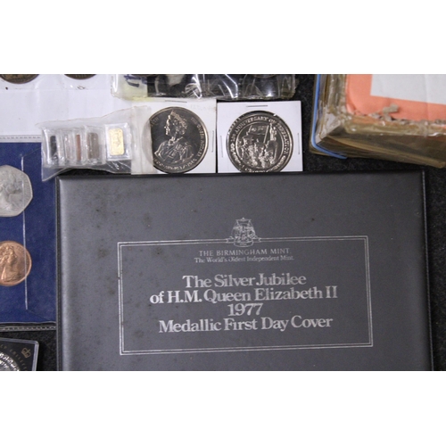 351 - A LARGE SELECTION OF WORLD COINS INCLUDING SILVER . ALSO NOTED A TIBETAN SILVER PAPERWEIGHT . E 60/8... 