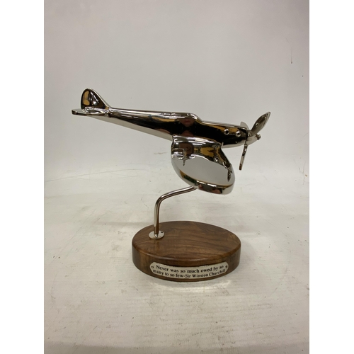 21 - A CHROME SPITFIRE ON A WOODEN BASE