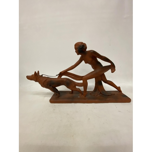 38 - AN ART DECO TERRACOTTA FIGURE OF A LADY AND HOUND 29