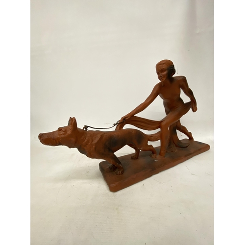 38 - AN ART DECO TERRACOTTA FIGURE OF A LADY AND HOUND 29