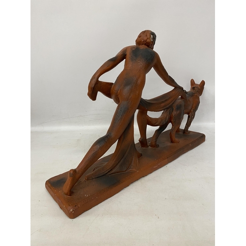 38 - AN ART DECO TERRACOTTA FIGURE OF A LADY AND HOUND 29