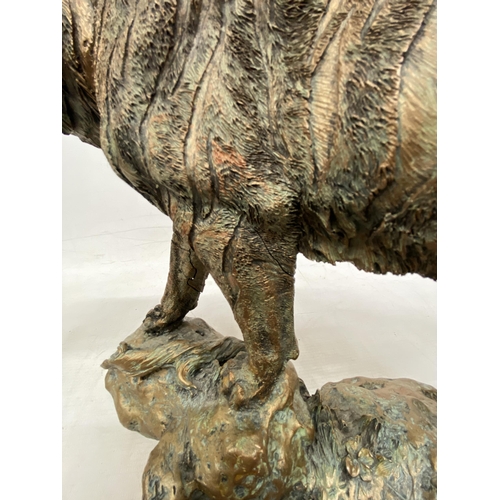 63 - A LARGE RESIN MODEL OF A TIGER HEIGHT 29CM LENGTH 40CM (FRONT LEG A/F)