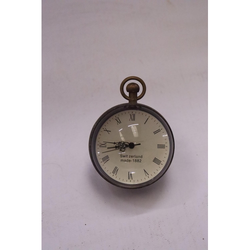 169 - A BRASS AND GLASS BUBBLE CLOCK