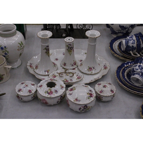 205 - A FLORAL PATTERNED, CERAMIC DRESSING TABLE SET TO INCLUDE A TRAY, CANDLESTICKS, HAT PIN HOLDER, TRIN... 