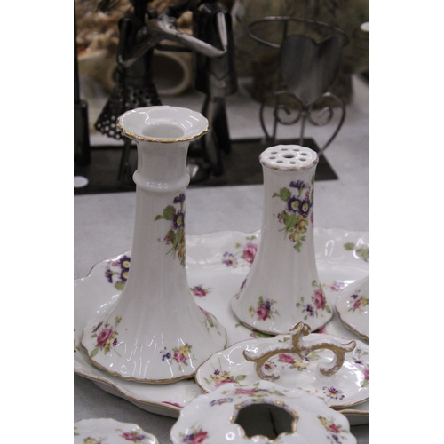 205 - A FLORAL PATTERNED, CERAMIC DRESSING TABLE SET TO INCLUDE A TRAY, CANDLESTICKS, HAT PIN HOLDER, TRIN... 