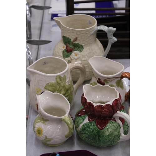 214 - FIVE SHORTER AND SON HAND PAINTED JUGS OF VARIOUS SIZES