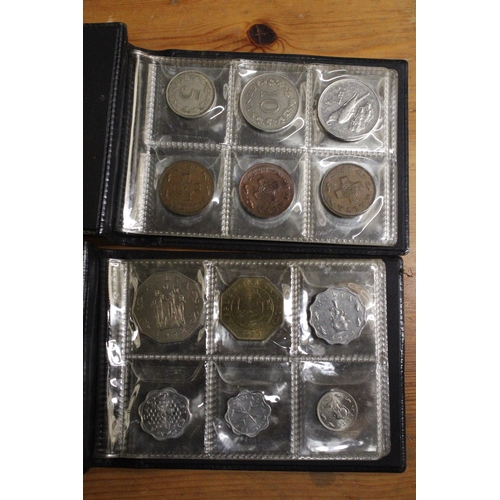 479 - TWO ALBUMS CONTAINING COINS OF MALTA