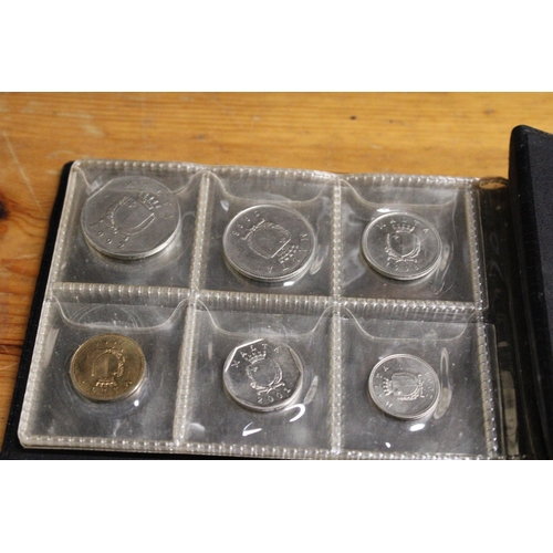 479 - TWO ALBUMS CONTAINING COINS OF MALTA