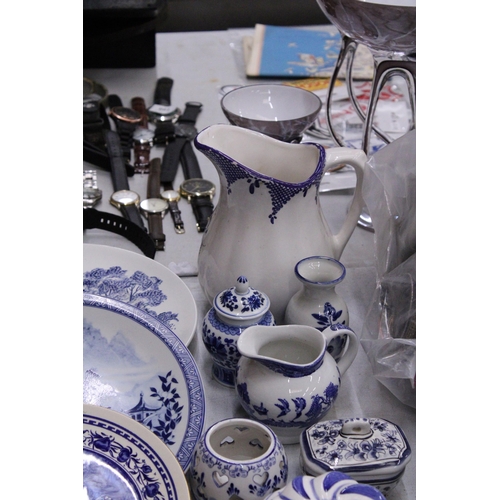 236 - A QUANTITY OF BLUE AND WHITE CERAMICS TO INCLUDE AN ANTIQUE BOOT WITH CREST TO THE BASE, PLATES, JUG... 