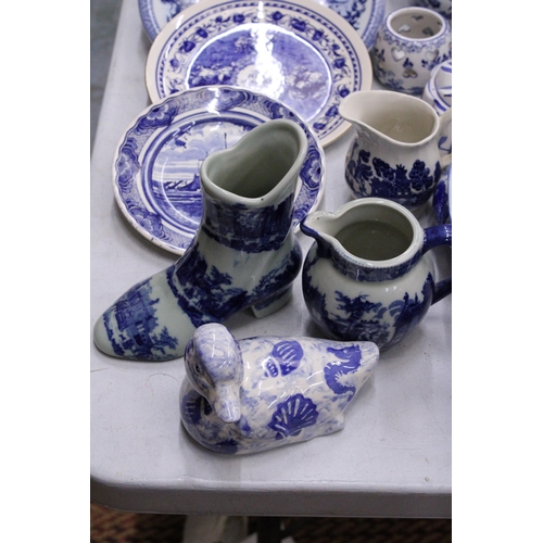 236 - A QUANTITY OF BLUE AND WHITE CERAMICS TO INCLUDE AN ANTIQUE BOOT WITH CREST TO THE BASE, PLATES, JUG... 