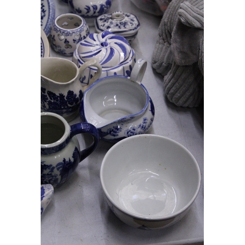 236 - A QUANTITY OF BLUE AND WHITE CERAMICS TO INCLUDE AN ANTIQUE BOOT WITH CREST TO THE BASE, PLATES, JUG... 