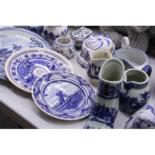 236 - A QUANTITY OF BLUE AND WHITE CERAMICS TO INCLUDE AN ANTIQUE BOOT WITH CREST TO THE BASE, PLATES, JUG... 