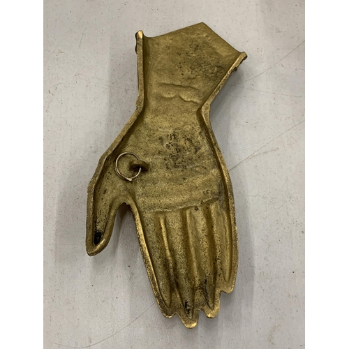 109 - A VINTAGE BRASS GAUNTLET