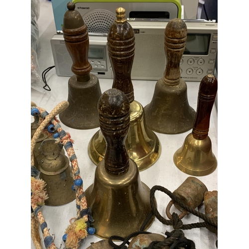 119 - A COLLECTION OF SEVEN VINTAGE BRASS BELLS PLUS SMALL COW BELLS