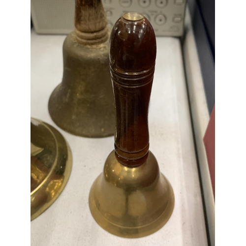 119 - A COLLECTION OF SEVEN VINTAGE BRASS BELLS PLUS SMALL COW BELLS