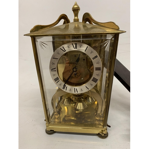 132 - A VINTAGE, POSSIBLY SCHATZ, ANNIVERSARY CLOCK PLUS A WOOD AND BRASS WALL SCONCE