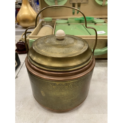 134 - A VINTAGE BRASS AND COPPER BISCUIT BARREL