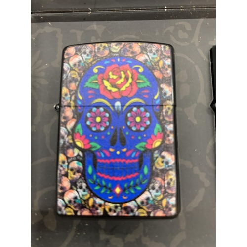 139 - FOUR NEW AND BOXED SKULL LIGHTERS