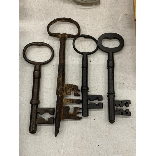 143 - FOUR VINTAGE LARGE KEYS TO INCLUDE ONE FROM THE 1700'S