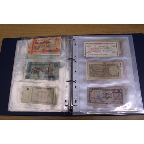 305 - A FOLDER CONTAINING IN EXCESS OF 100 VINTAGE WORLD BANK NOTES TO INCLUDE THE CENTRAL BANK OF EGYPT 5... 