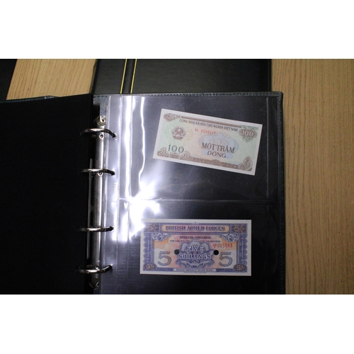 311 - A FOLDER CONTAINING A QUANTITY OF VINTAGE WORLD BANK NOTES TO INCLUDE A COLLECTION OF BRITISH ARMED ... 