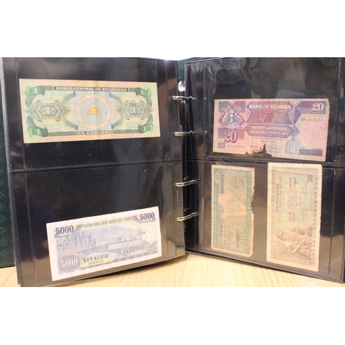 312 - A FOLDER CONTAINING VINTAGE WORLD BANK NOTES TO INCLUDE JAPANESE CURRENCY, BULGARIA, UGANDA, NIGERIA... 