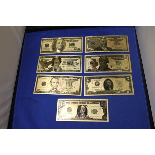 411 - SEVEN 24 CARAT GOLD FOIL UNITED STATES OF AMERICA DOLLARS OF VARIOUS DENOMINATIONS