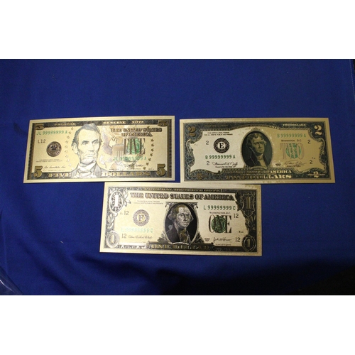 411 - SEVEN 24 CARAT GOLD FOIL UNITED STATES OF AMERICA DOLLARS OF VARIOUS DENOMINATIONS