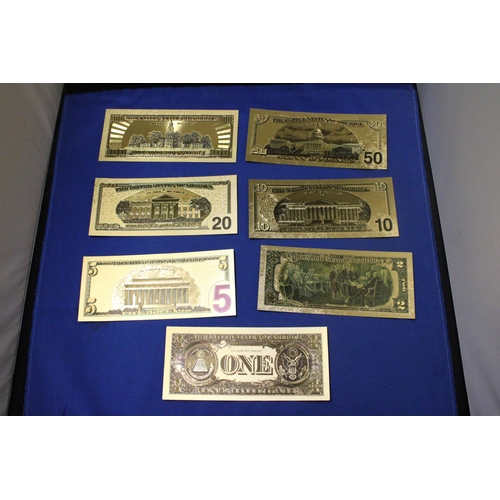 411 - SEVEN 24 CARAT GOLD FOIL UNITED STATES OF AMERICA DOLLARS OF VARIOUS DENOMINATIONS