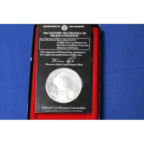 423 - A 1984 OLYMPIC COIN .900 SILVER IN A PRESENTATION BOX