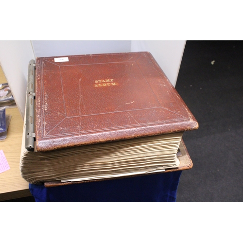 486 - A VERY LARGE ANTIQUE LEATHER BOUND STAMP LEDGER CONTAINING MINT AND USED STAMPS FROM 1840 ONWARDS (S... 