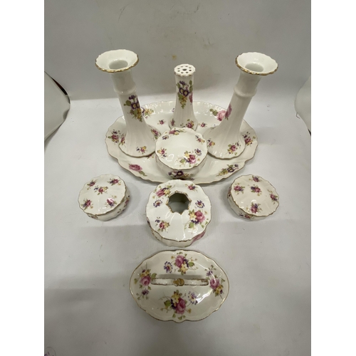 186 - A FLORAL PATTERNED, CERAMIC DRESSING TABLE SET TO INCLUDE A TRAY, CANDLESTICKS, HAT PIN HOLDER, TRIN... 