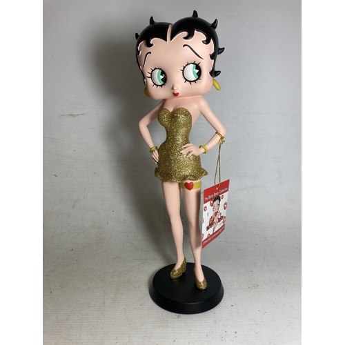 19 - A BETTY BOOP FIGURE IN A GOLD GLITTER DRESS - 31 CM