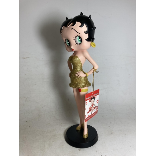 19 - A BETTY BOOP FIGURE IN A GOLD GLITTER DRESS - 31 CM