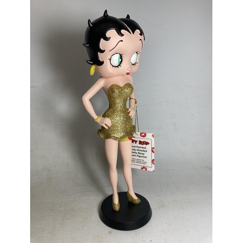 19 - A BETTY BOOP FIGURE IN A GOLD GLITTER DRESS - 31 CM