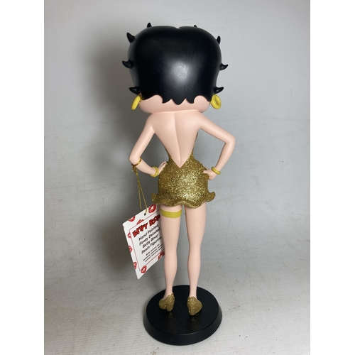 19 - A BETTY BOOP FIGURE IN A GOLD GLITTER DRESS - 31 CM