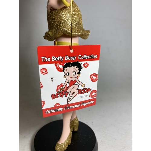 19 - A BETTY BOOP FIGURE IN A GOLD GLITTER DRESS - 31 CM