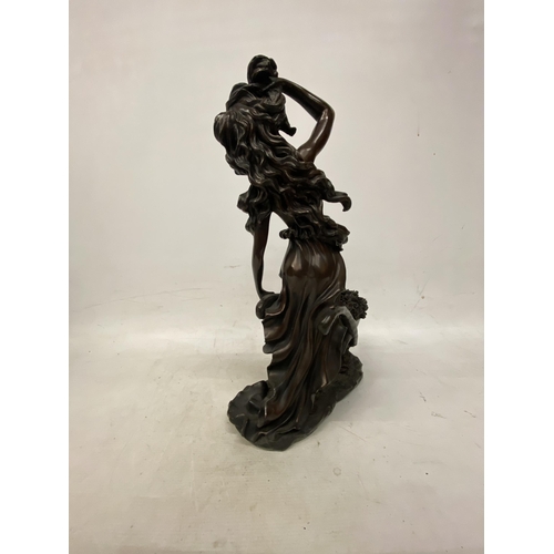 214 - A LARGE FIGURINE OF A WOMAN WITH WHEELBARROW FULL OF FLOWERS APPROXIMATLEY - 47CM HIGH