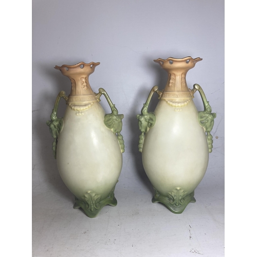 22 - A PAIR OF ANTIQUE VASES WITH TWIN HANDLES IN THE SHAPE OF GOATS DEPICTING SCHNAUZER DOGS - 30.5 CM