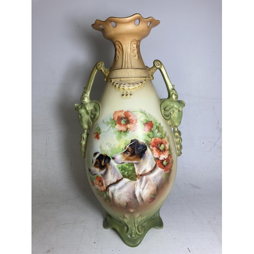 22 - A PAIR OF ANTIQUE VASES WITH TWIN HANDLES IN THE SHAPE OF GOATS DEPICTING SCHNAUZER DOGS - 30.5 CM