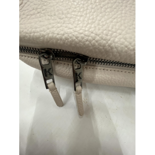 227 - AN AS NEW GENUINE BEIGE COLOURED KARL LAGERFELD BAG