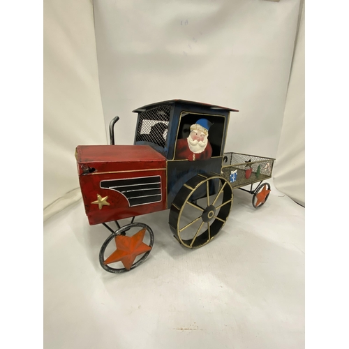 228 - A LARGE TIN PLATE 'SANTA' TRACTOR AND TRAILER, HEIGHT 22CM X 48CM