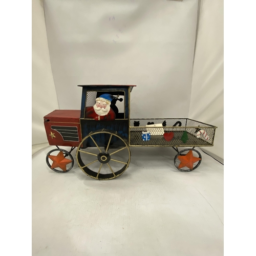 228 - A LARGE TIN PLATE 'SANTA' TRACTOR AND TRAILER, HEIGHT 22CM X 48CM